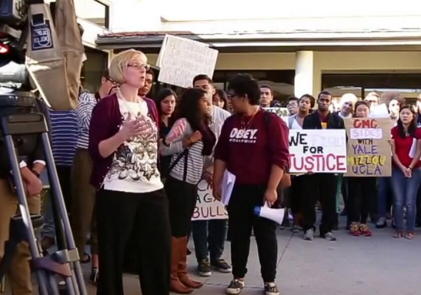 Dean of Students Mary Spellman apologizes to Claremont McKenna students at a campus protest for more diversity. She later resigned. Several student protesters say they have left campus following a death threat.