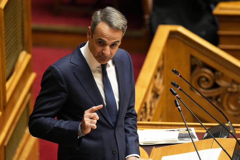 Greece Prime Minister Kyriakos Mitsotakis speaks during a parliament session in Athens, on Thursday, March 28, 2024. A Greek opposition party Tuesday submitted a motion of no-confidence against the government, saying that it tried to cover up its responsibility over a deadly rail disaster last year that shocked Greece. The three-day debate in parliament is due to end with a vote late Thursday. March 28. (AP Photo/Petros Giannakouris)