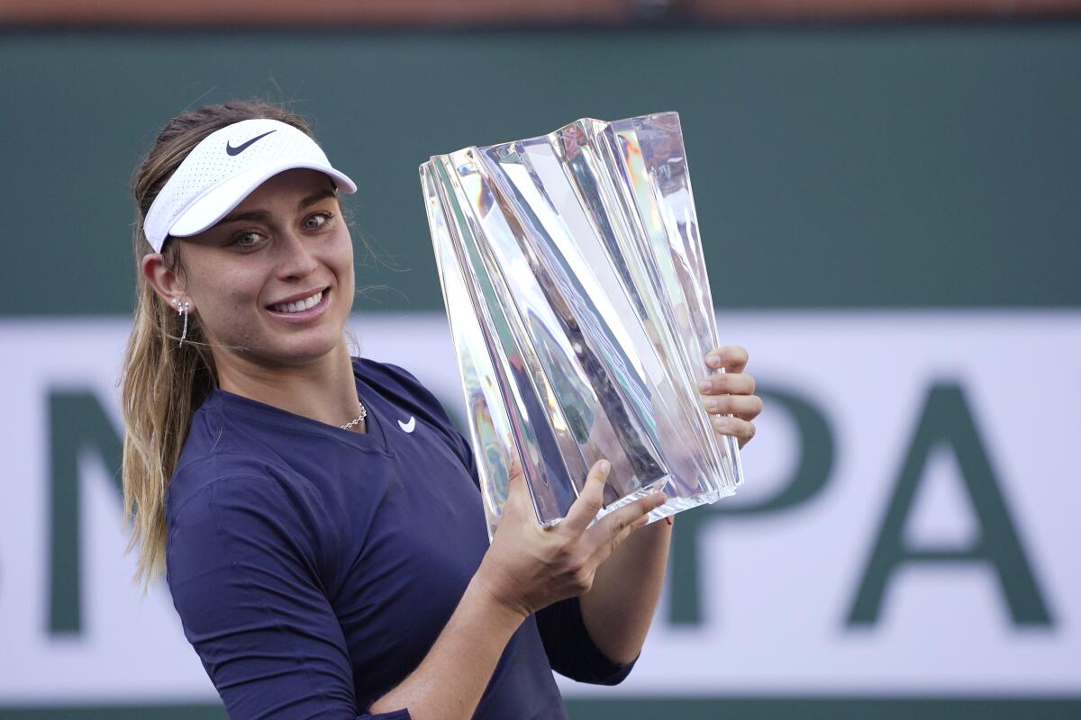 Paula Badosa, of Spain, holds up her trophy after defeating Victoria Azarenka 