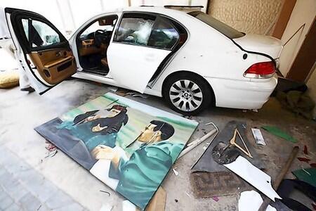 A portrait of Gaddafi and his mother is seen by his armoured car at Hannibal Gaddafi's house in Tripoli.