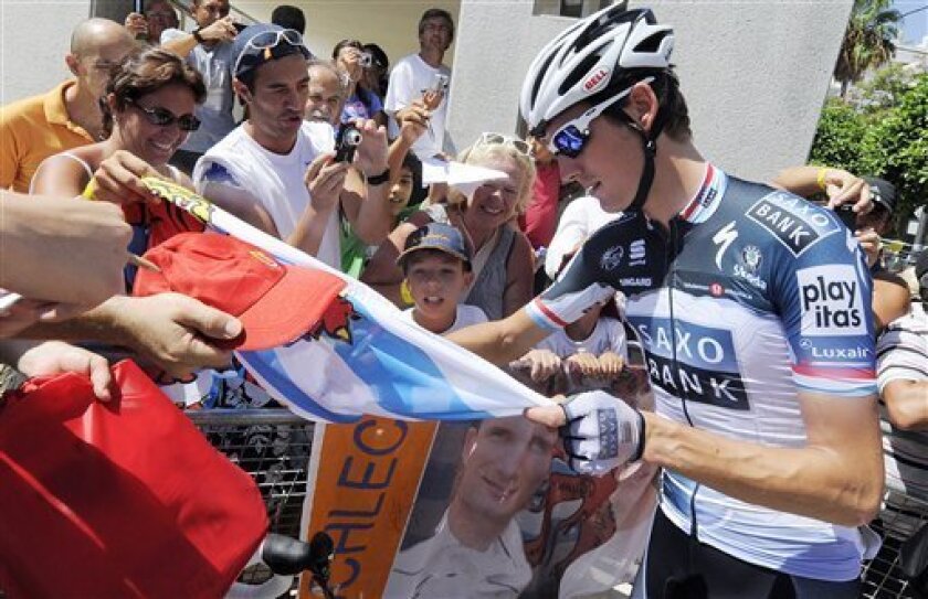 In this photo taken on Monday, Aug. 30, 2010, and made available on Tuesday, Sept. 7, 2010, Team Saxo Bank rider Andy Schleck, before the eighth stage of the Spanish Vuelta between Villena and Xorret de Cati, Spain. Schleck said on Tuesday, Sept. 7, 2010, he and teammate Stuart O'Grady have been removed from the Spanish Vuelta because they drank alcohol. Schleck said he broke a team rule "by going out for a drink after dinner". (AP Photo/Alberto Saiz)