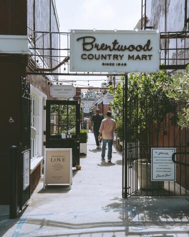 The sign and entrance of the Brentwood Country Mart.