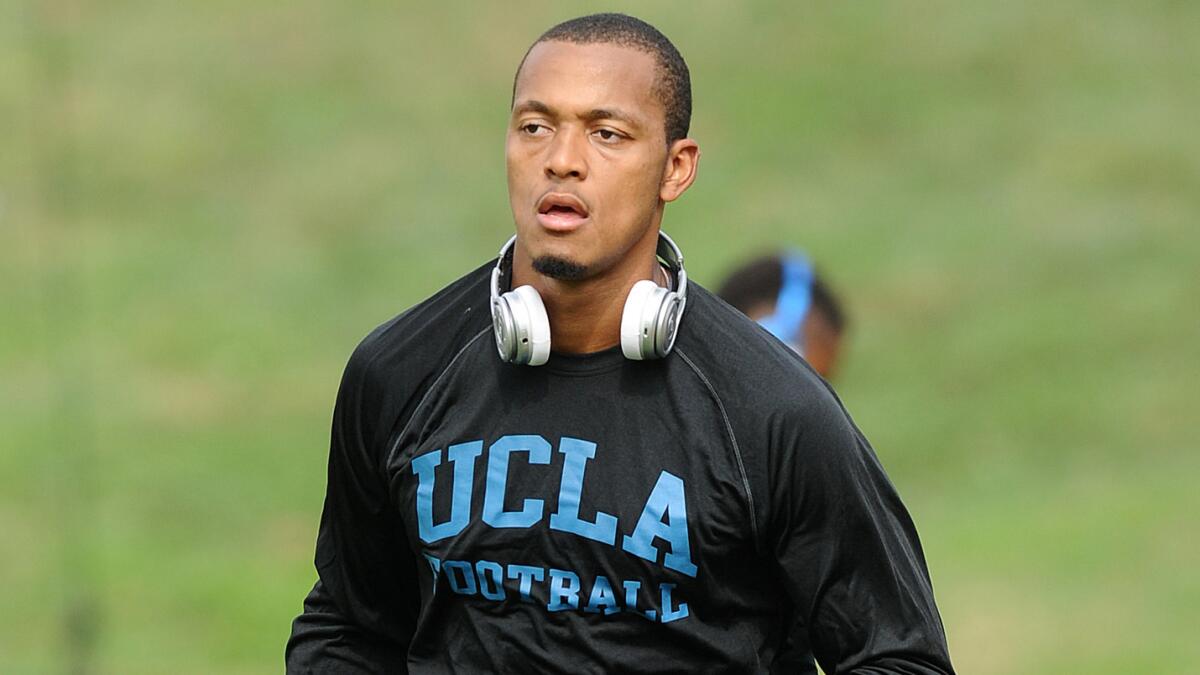 UCLA quarterback Brett Hundley warms up before last week's win over Virginia. Hundley will be looking to put up a Heisman-caliber performance against Memphis on Saturday.