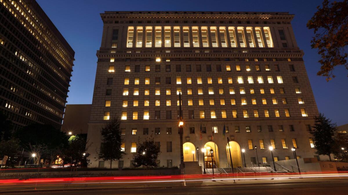 The L.A. County sheriff's headquarters in the Hall of Justice in downtown Los Angeles. The Sheriff’s Department saw a 40% decline in new excessive-force lawsuits and a 33% drop in cases involving deputy-related shootings in the 2016-17 fiscal year.