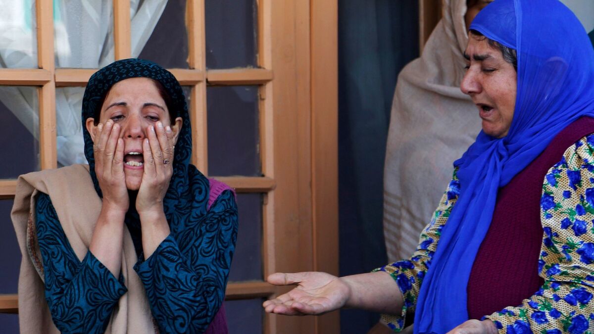 Members of Ghulam Mohammad Khan's family cry during his funeral in Srinagar, India, on May 1, 2017. Khan was among those killed in an attack outside a police station in Srinagar late Sunday, police said.