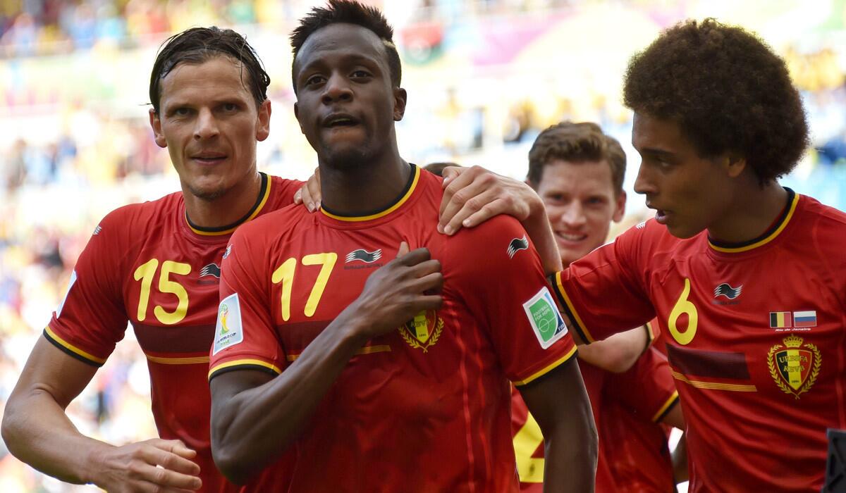 Belgium forward Divock Origi (17) celebrates with teammates, including Daniel Van Buyten (15) and Axel Witsel (6), after scoring against Russia in a 1-0 victory in World Cup Group H play.