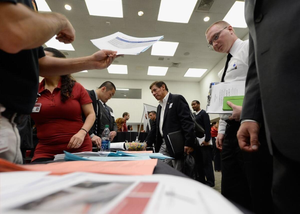 Veterans peruse employment openings at a job fair last month in Los Angeles.