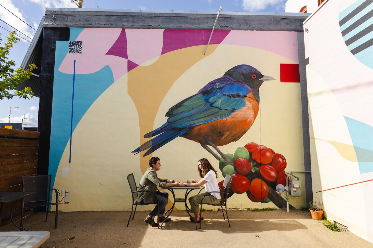 A mural of a bird on top of tomatoes. 