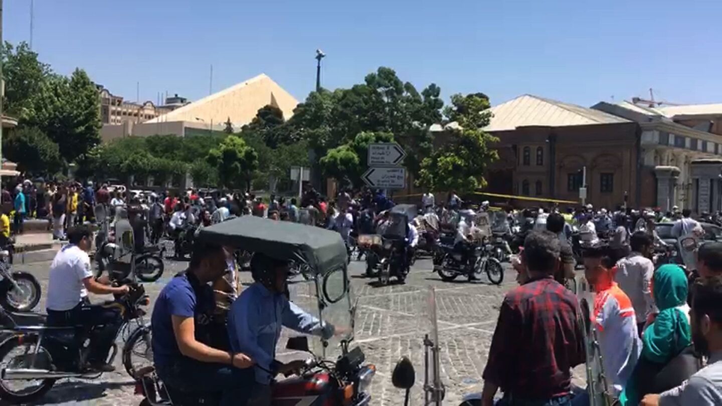 An image grab taken from AFPTV shows the scene outside the Iranian parliament in Tehran on Wednesday during an attack on the complex.