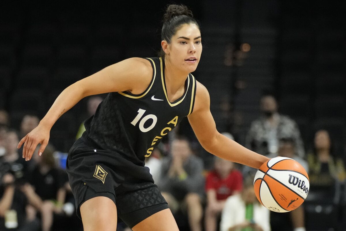 Las Vegas Aces' Kelsey Plum (10) drives against the Dallas Wings during the second half of a WNBA basketball game Sunday, June 5, 2022, in Las Vegas. (AP Photo/John Locher)