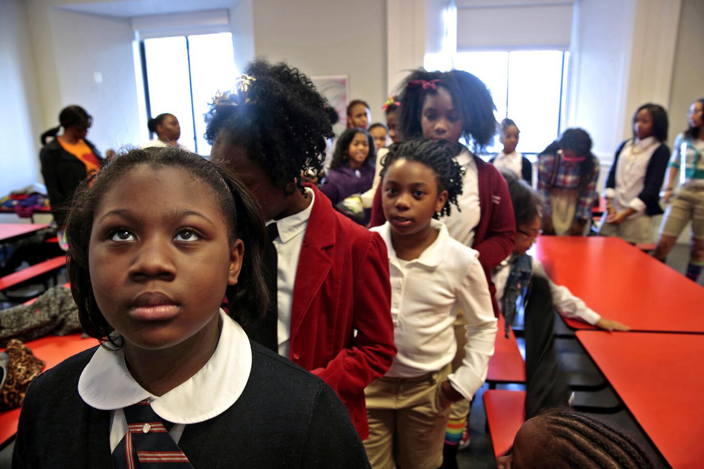 Kennedy Pelt, 9, left, waits with other members of the the Camden Sophisticated Sisters Drill Team to perform at the Philadelphia Museum of Art on Jan. 20, Martin Luther King Jr. Day.