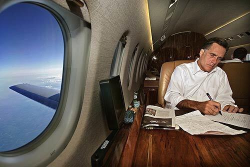 Mitt Romney works on a speech on a jet in 2007.