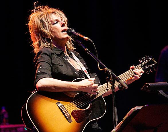 Singer-songwriter Lucinda Williams performs with her band at the Wiltern Theatre on Friday.