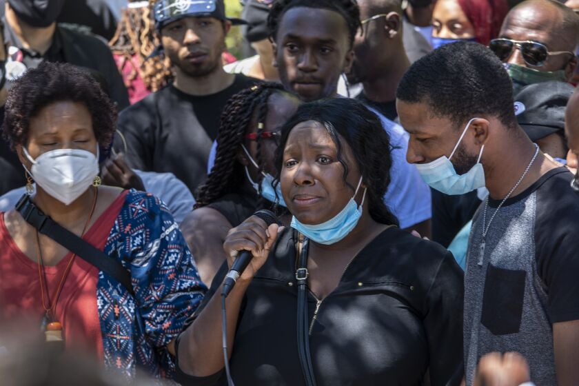 PALMDALE, CA - JUNE 13: Diamond Alexander, center, sister of Robert Fuller, pleads for justice for her brother as hundreds of gathered in Palmdale on Saturday to mourn the death of Fuller on Saturday, June 13, 2020 in Palmdale, CA. (Brian van der Brug / Los Angeles Times)