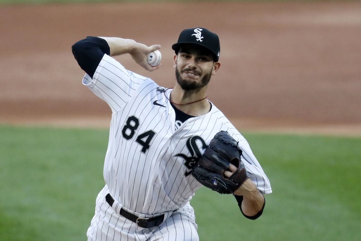 Chicago White Sox starting pitcher Dylan Cease delivers during the first inning of a baseball game against the Cleveland Indians, Friday, Aug. 7, 2020, in Chicago. (AP Photo/Charles Rex Arbogast)