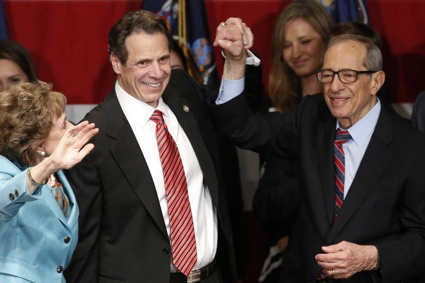 Mario Cuomo and his wife, Matilda, join son Andrew Cuomo to celebrate his reelection as governor of New York. The younger Cuomo was sworn in Jan. 2, hours before Mario Cuomo's death.