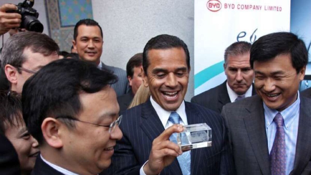 In 2010, BYD's California venture focused on electric cars, including the e6. BYD Chairman Wang Chuanfu presents then-Los Angeles Mayor Antonio Villaraigosa a gift depicting the car, which was never marketed to U.S. consumers.