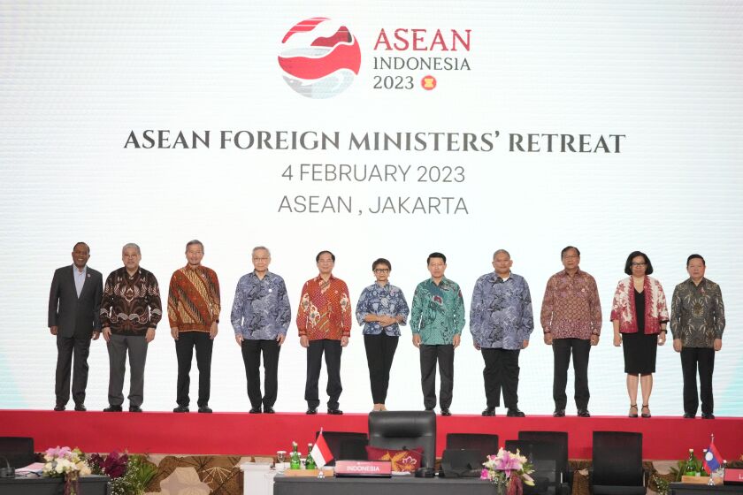 From left to right; Malaysian Foreign Minister Zambry Abdul Kadir, Philippine's Foreign Secretary Enrique Manalo, Singaporean Foreign Minister Vivian Balakrishnan, Thailand's Foreign Minister Don Pramudwinai, Vietnam's Foreign Minister Bui Thanh Son, Indonesian Foreign Minister Retno Marsudi, Laotian Foreign Minister Saleumxay Kommasith, Brunei's Second Minister of Foreign Affair Erywan Yusof, Cambodia's Foreign Minister Prak Sokhonn, East Timor's Foreign Minister Adaljiza Magno and ASEAN Secretary General Kao Kim Hourn pose for a group photo during the Association of Southeast Asian Nations (ASEAN) foreign ministers retreat in Jakarta, Indonesia, Saturday, Feb. 4, 2023. (AP Photo/Achmad Ibrahim)