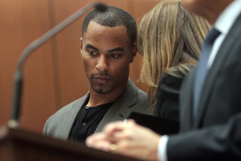 Former NFL safety Darren Sharper, with his attorney Blair Berk, pleads not guilty to charges of drugging and raping a pair of women he met at a West Hollywood nightclub, in a Los Angeles Superior courtroom Thursday.