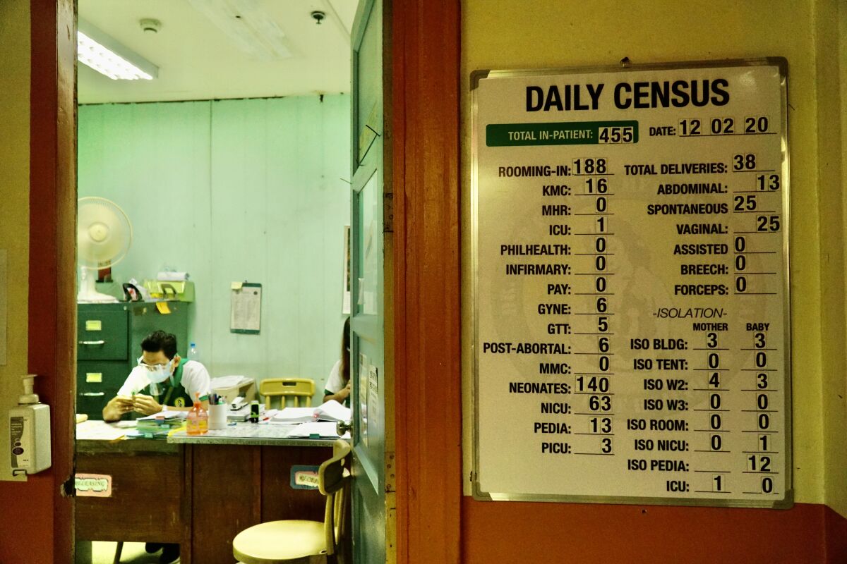 A sign lists daily patient data