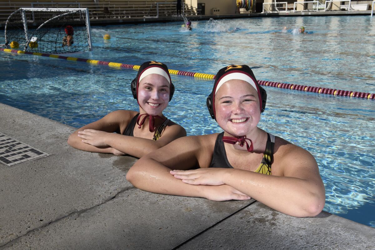 Bishop’s seniors Katie Scott (left) and Sierra Martin are key members of a Knights girls water polo program seeking its 16th San Diego Section crown.