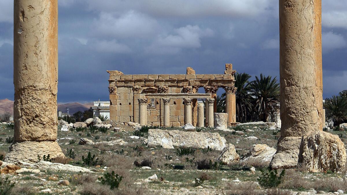 A picture taken on March 14, 2014, shows the Temple of Baalshamin, seen between two Corinthian columns in the ancient oasis city of Palmyra, Syria.
