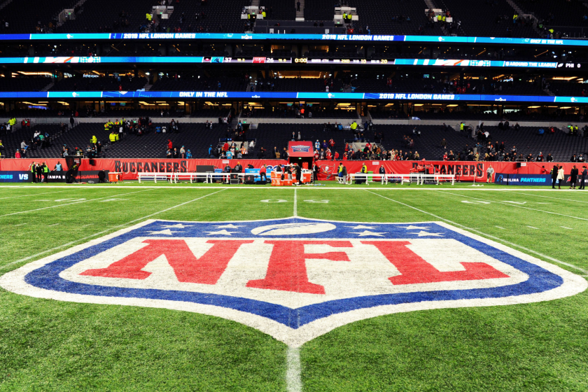 Detailed view of the NFL logo on the field.