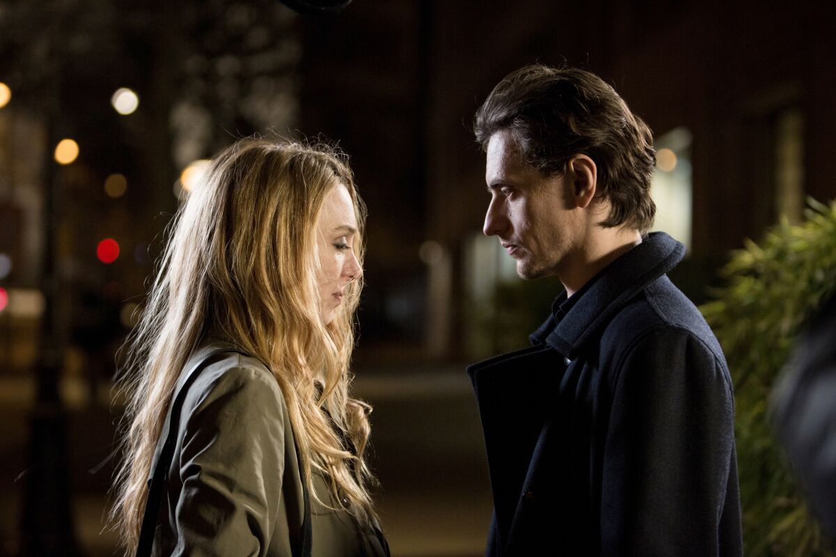 A woman facing a man in the movie “Simple Passion.”