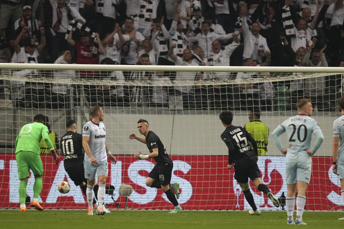 Frankfurt's Rafael Santos Borre, center, celebrates after scoring his sides first goal during the Europa League semi final second leg soccer match between Eintracht Frankfurt and West Ham United in Frankfurt, Germany, Thursday, May 5, 2022. (AP Photo/Michael Probst)