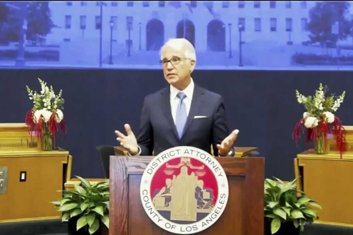 In this photo from the County of Los Angeles streaming video, incoming Los Angeles County District Attorney George Gascon speaks after he was is sworn in in downtown Los Angeles Monday, Dec. 7, 2020. Gascon, who co-authored a 2014 ballot measure to reduce some nonviolent felonies to misdemeanors, has promised more reforms to keep low-level offenders, drug users, and those who are mentally ill out of jail and has said he won't seek the death penalty. (County of Los Angeles via AP)