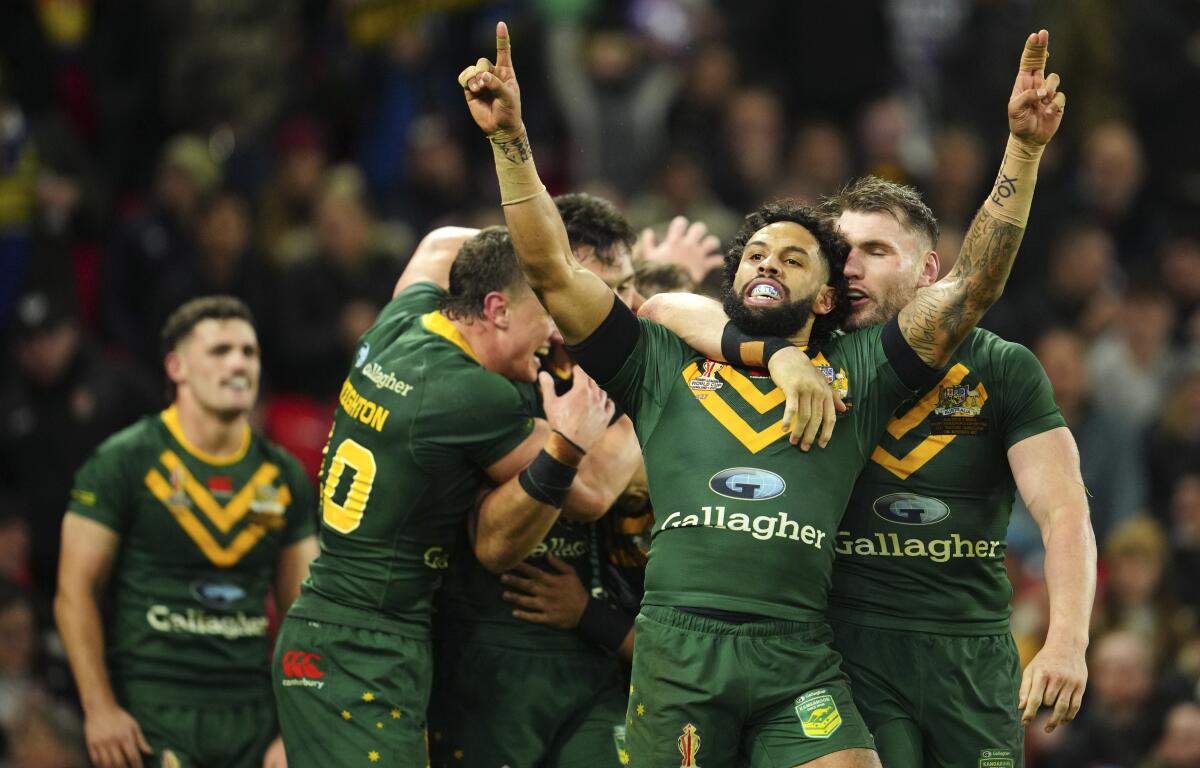 FILE - Australia's Josh Addo-Carr celebrates at the end of the Rugby League World Cup final match between Australia and Samoa at the Old Trafford Stadium in Manchester, England, Saturday, Nov. 19, 2022. When deciding whether to try to expand its impact to the United States, Australia's National Rugby League used a distinctly American sport as a model. A doubleheader Saturday night, March 2, 2024, at Las Vegas' Allegiant Stadium, which hosted the Super Bowl on Feb. 11, will be televised nationally in the U.S. on FS1.(AP Photo/Jon Super, File)