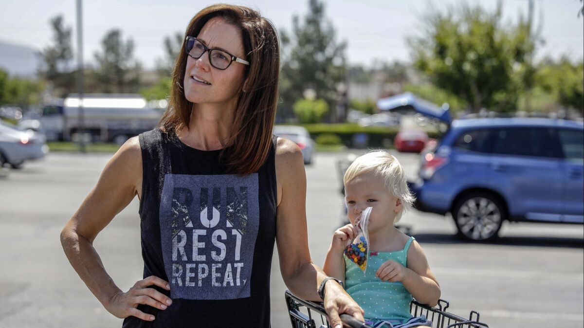 Erin Griffin, with her daughter Julia, in Temecula. Griffin said that Hunter's indictment worried her but that she'd "have a hard time supporting a Democrat."