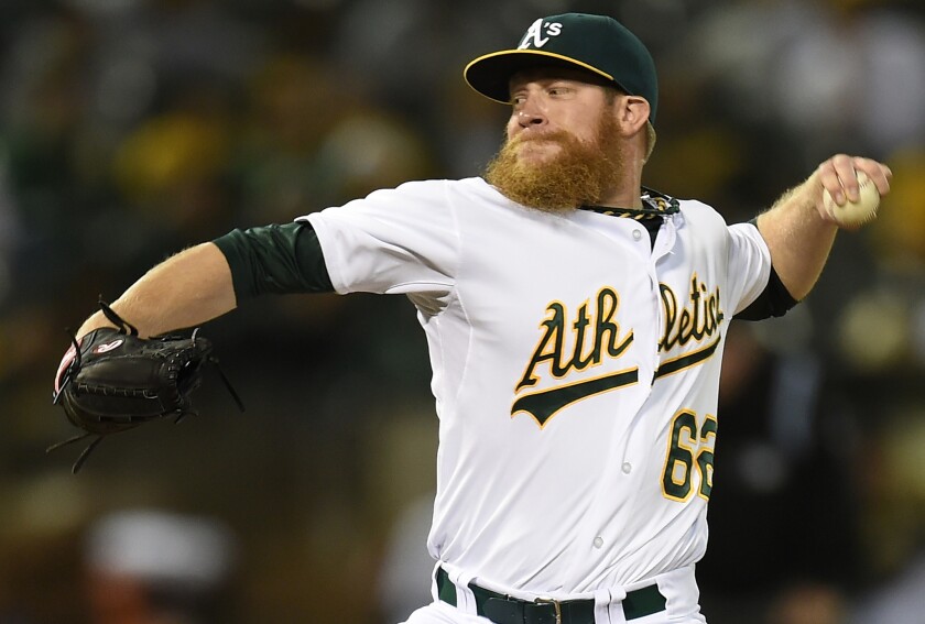 Oakland's Sean Doolittle, shown in 2014, aims to regain a late-inning role this spring after being slowed by shoulder problems the last two seasons.