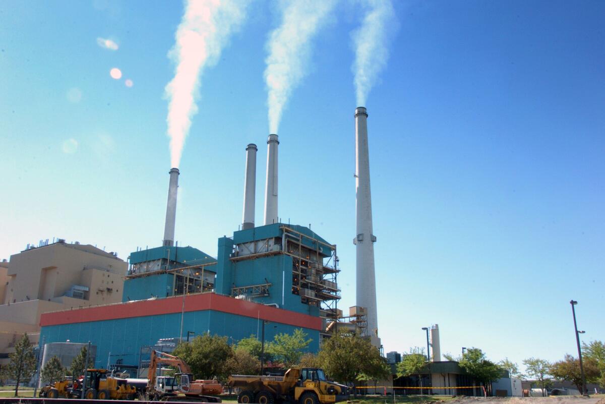 Smoke rises from the Colstrip Steam Electric Station, a coal-burning power plant in Colstrip, Mont., in 2013.