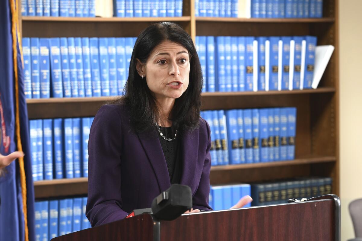 FILE - Attorney General Dana Nessel speaks during a news conference in Detroit, Thursday, Oct. 14, 2021. Published reports say Nessel’s office is asking that a special prosecutor investigate whether the Republican candidate for state attorney general, Matt DePerno, and others should be charged in connection with an effort to gain access to voting machines after the 2020 election. DePerno has been endorsed by former President Donald Trump. (Max Ortiz/Detroit News via AP, File)