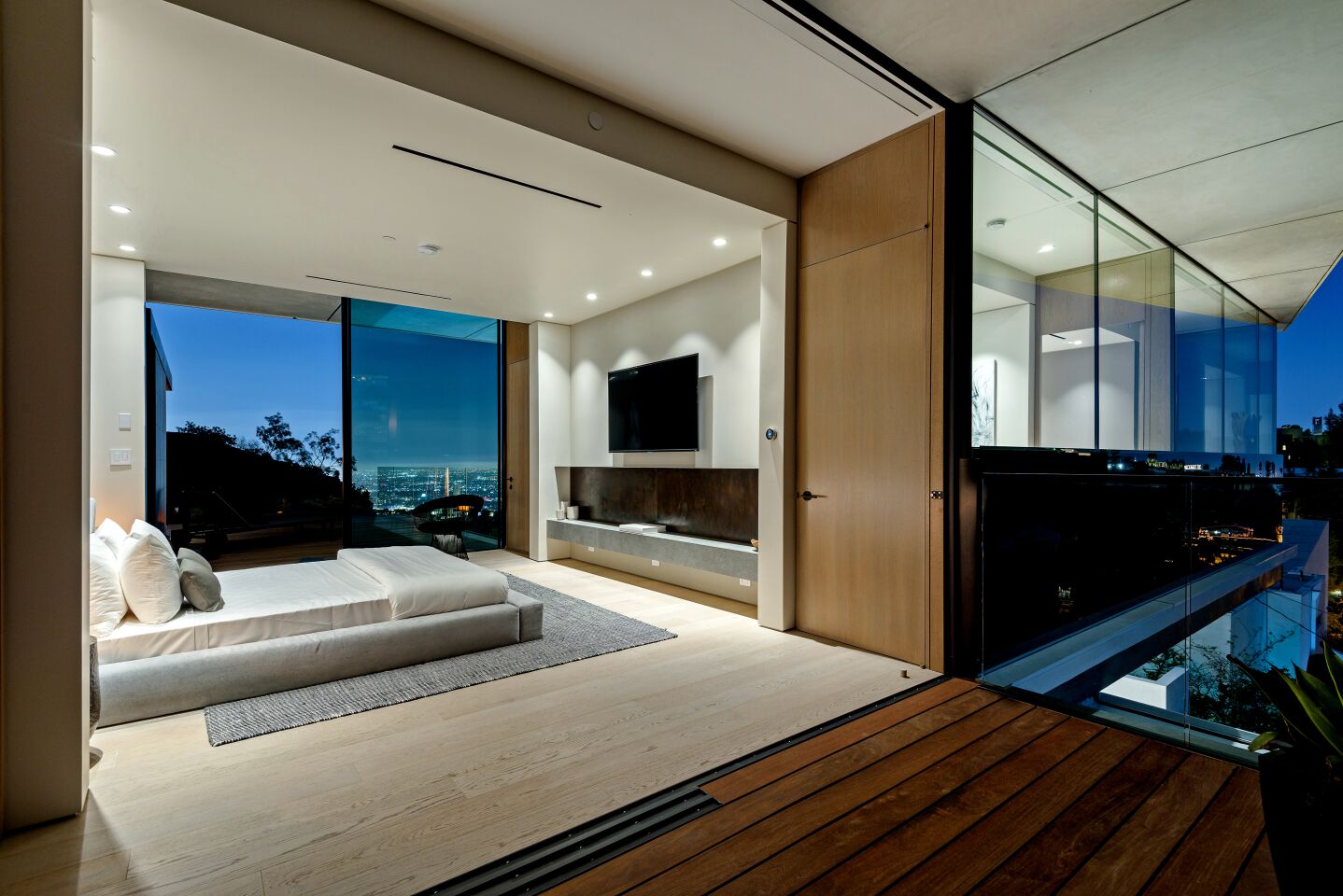 NBA player Parsons has room to stretch out in the house, which has clean lines and a lot of glass.