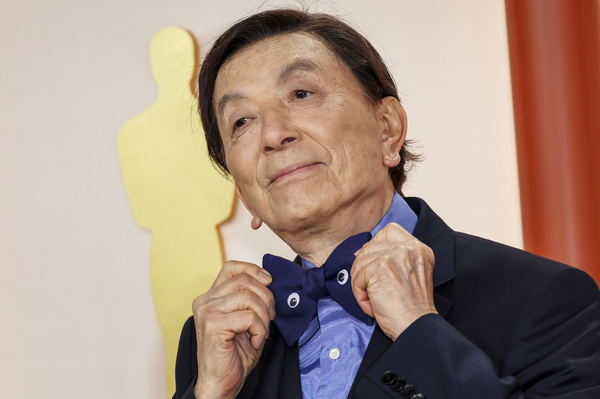 James Hong shows off the googly eyes on his dark bow tie.