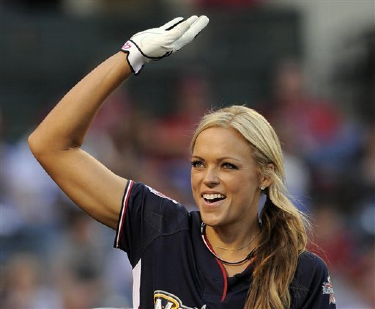 FILE - This July 11, 2010, file photo shows softball player Jennie Finch reacting after hitting a home run during the All-Star Legends & Celebrity softball game, in Anaheim, Calif. Finch plans to retire next month and bring an end to a 10-year career in which she helped the sport blossom in the United States. The dominating pitcher announced Tuesday, July 20, 2010, that she will play her final games with the U.S. national team this week at the World Cup of Softball in Oklahoma City. (AP Photo/Mark J. Terrill)