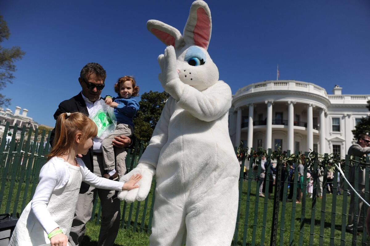 The Easter Bunny greets children during the annual White House Easter Egg Roll on the South Lawn of the White House.