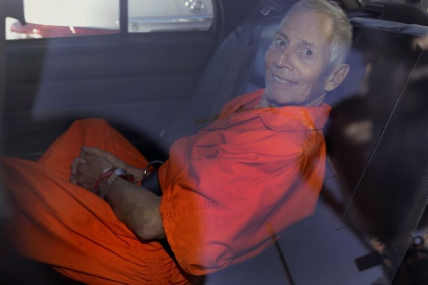 Robert Durst after a court proceeding in New Orleans in March 2015. The New York real estate scion's attorneys say he's ill and should serve his sentence on a weapons charge in a Los Angeles-area prison hospital.