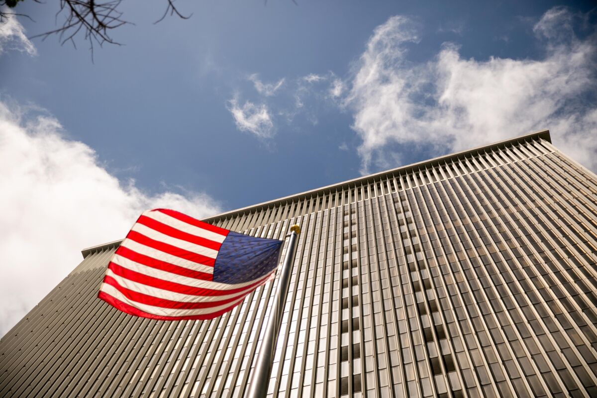 A tall building with a U.S. flag in front