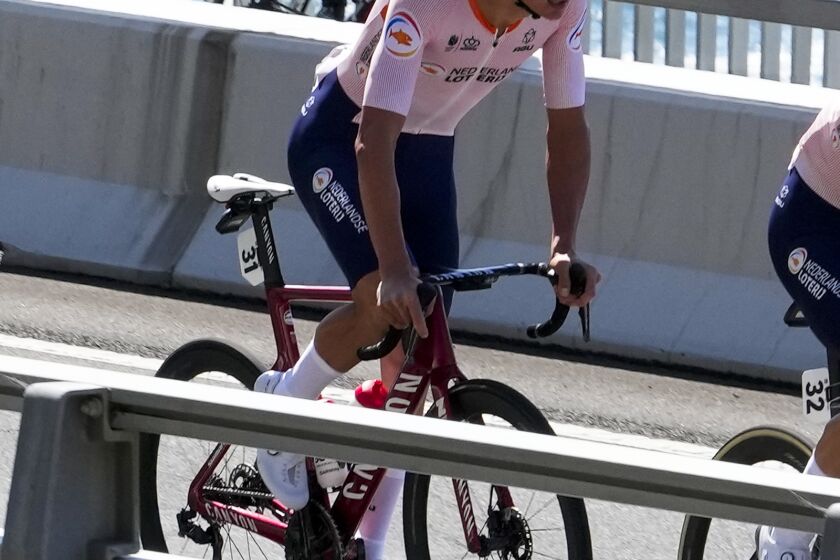 Mathieu van der Poel of the Netherlands rides across the Sea Cliff Bridge during the elite men's road race at the world road cycling championships in Wollongong, Australia, Sunday, Sept. 25, 2022. (AP Photo/Rick Rycroft)