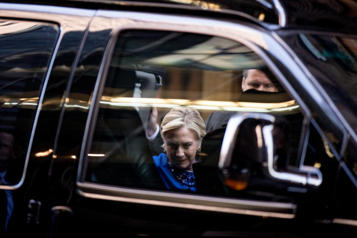 Hillary Clinton hops in an SUV to depart a fundraiser at the St. Regis Hotel in New York on Oct. 6, 2016.
