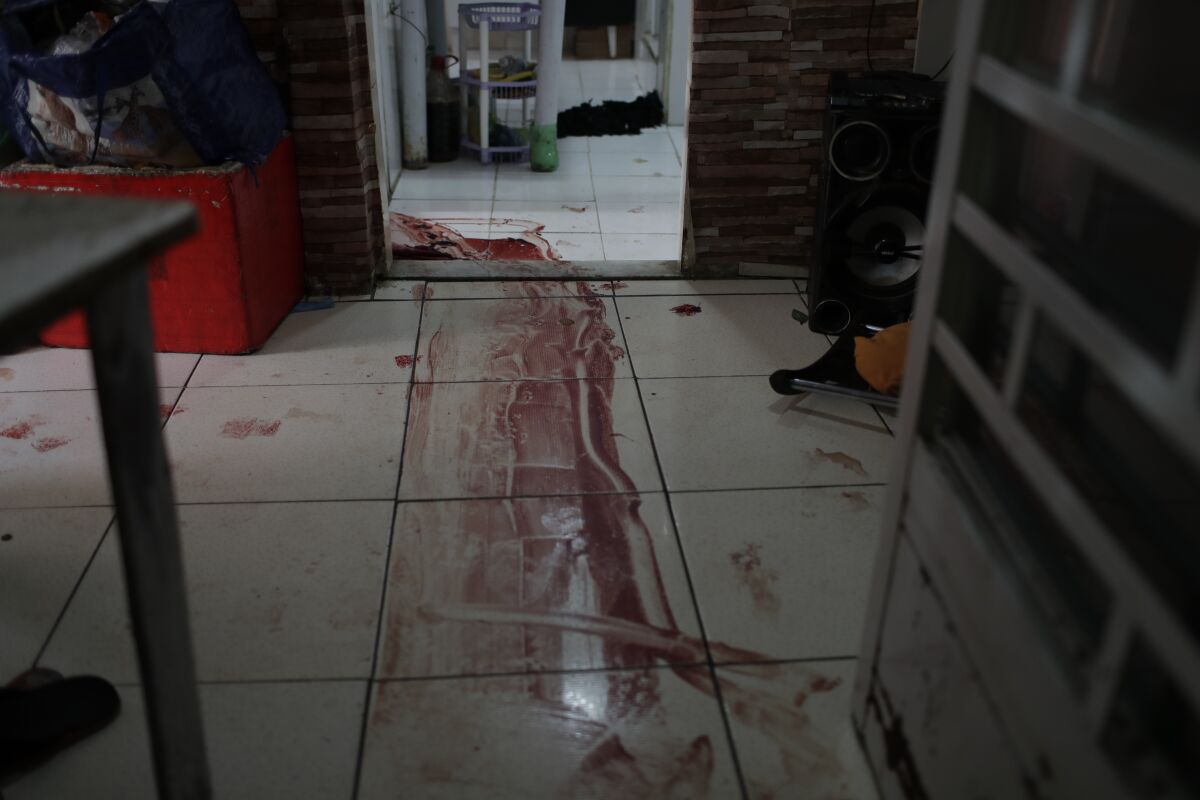 Blood on floor of a home in Rio