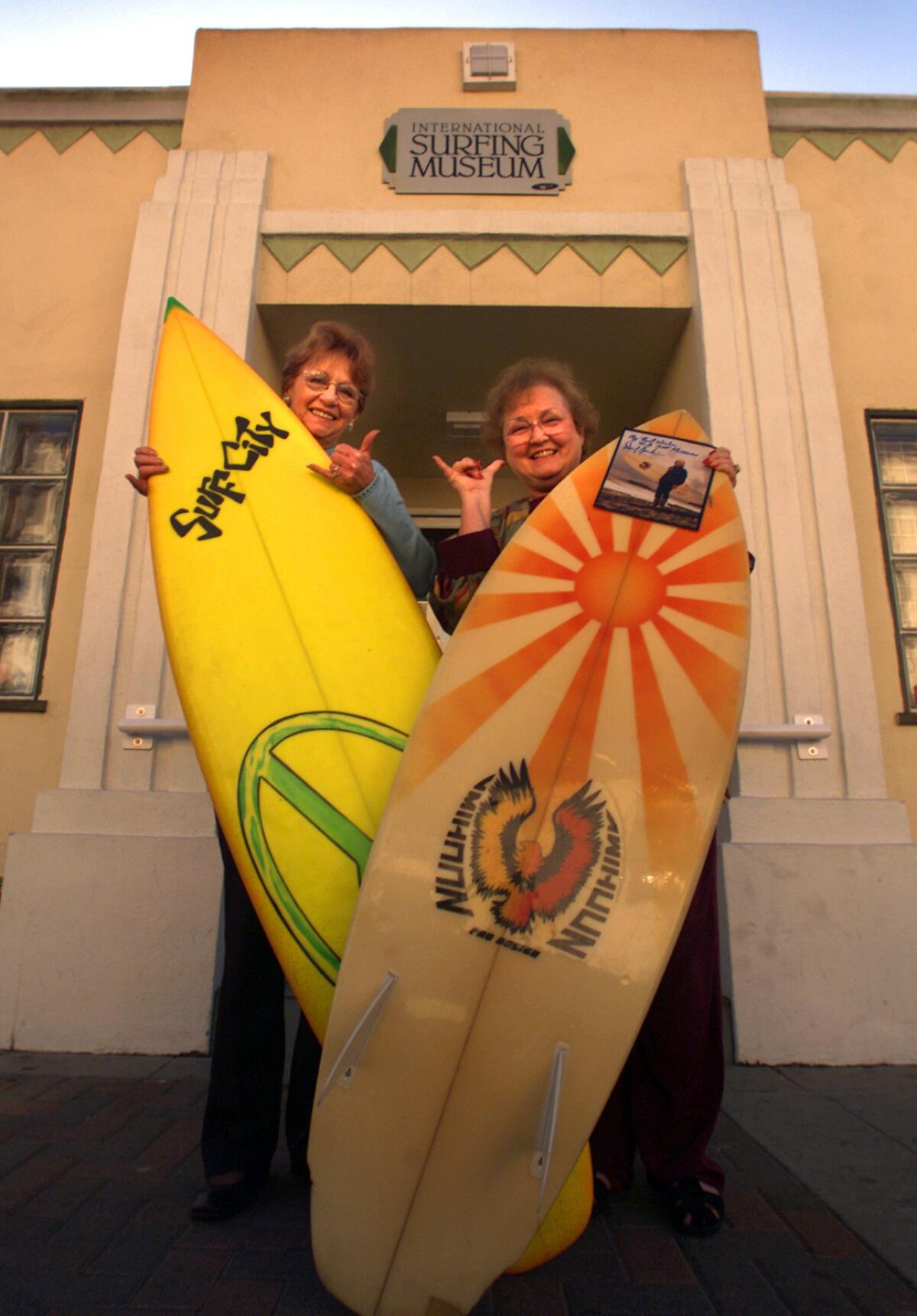 Natalie Kotsch, left, with Ann Beasley outside the Huntington Beach International Surfing Museum in 2002.