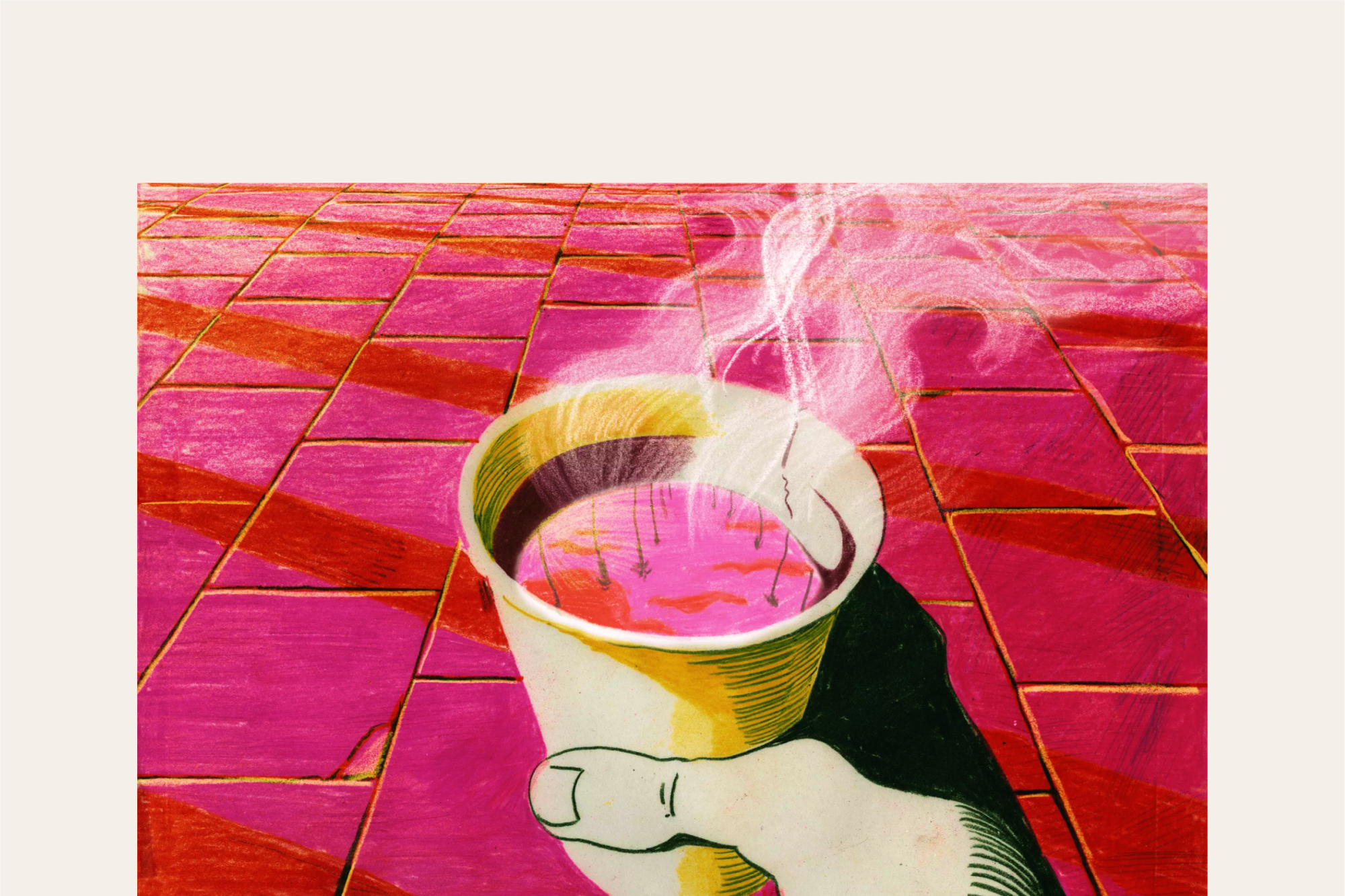 A hand holding a steaming cup of coffee
