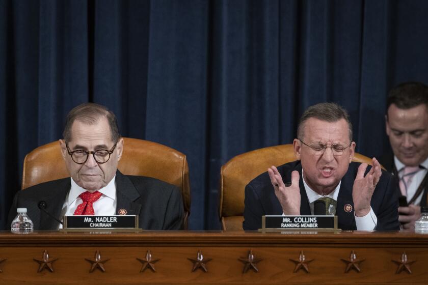 House Judiciary Committee ranking member Rep. Doug Collins (R-Ga.) speaks alongside Chairman Rep. Jerrold Nadler (D-N.Y.) during debate over markup of the articles of impeachment against President Trump on Thursday.