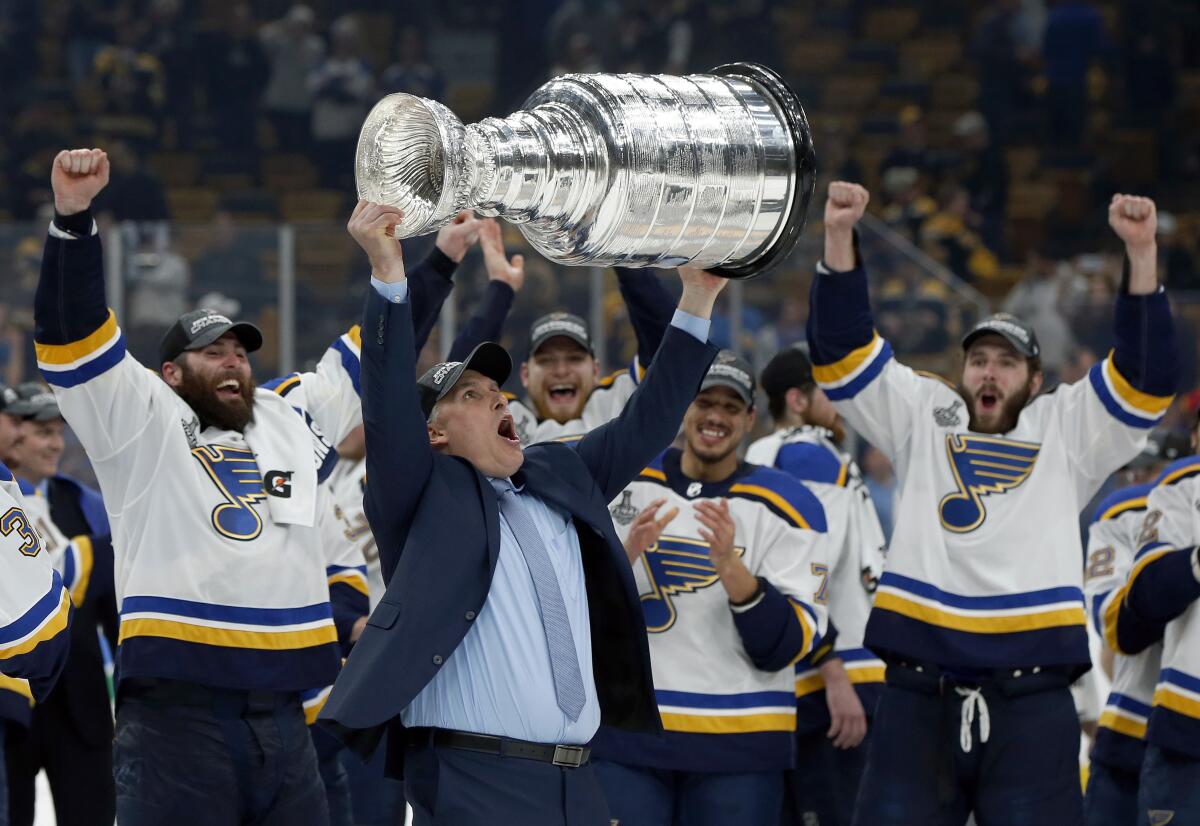 Coach Craig Berube celebrates after St. Louis beat Boston in Game 7 of the 2019 Stanley Cup Final. The NHL revealed its plan for a modified 2020 playoff format Tuesday.