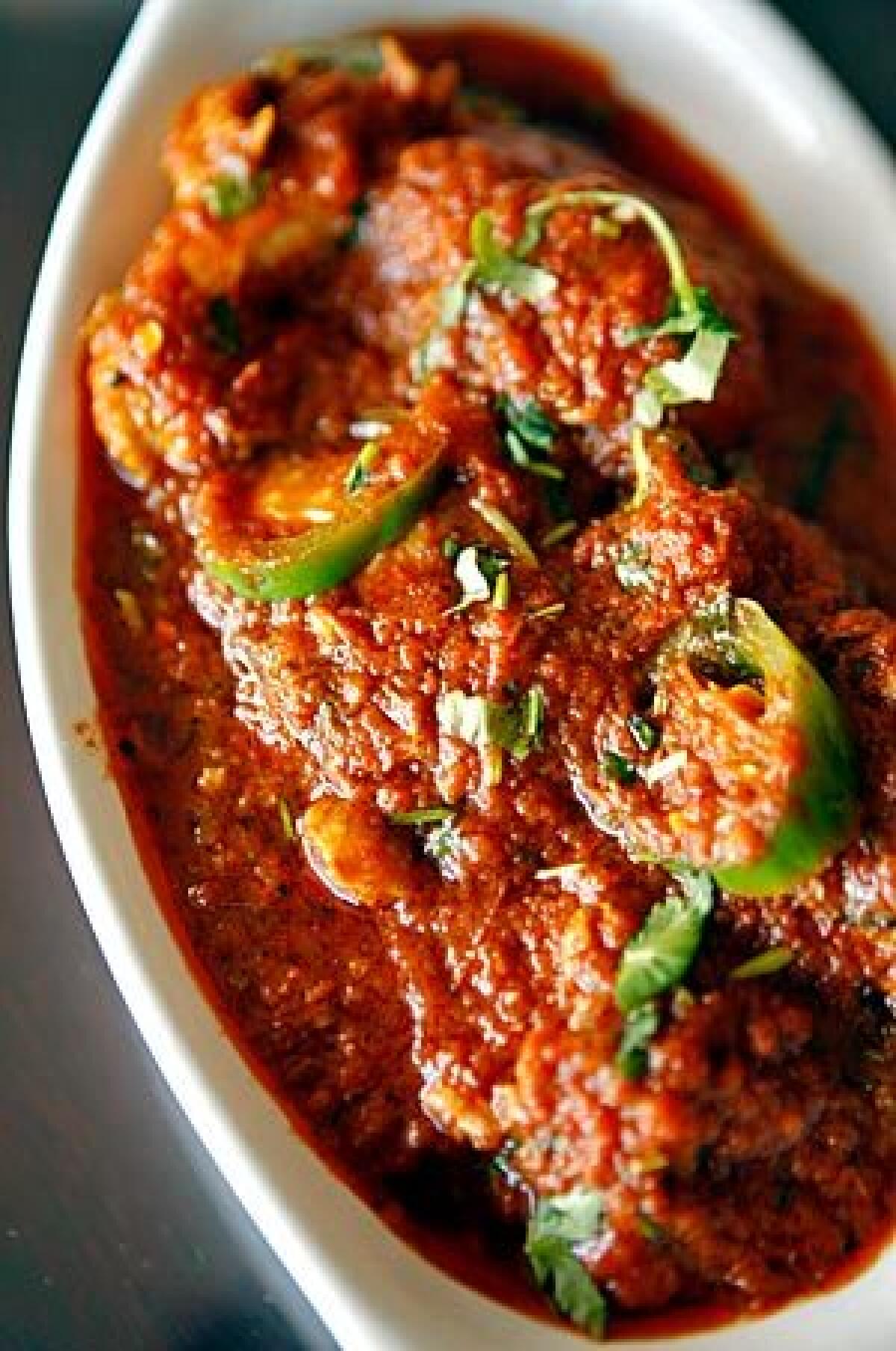 Chicken Karahi -- a mild curry dish with cooked tomatoes -- is on the menu at Red Chili.