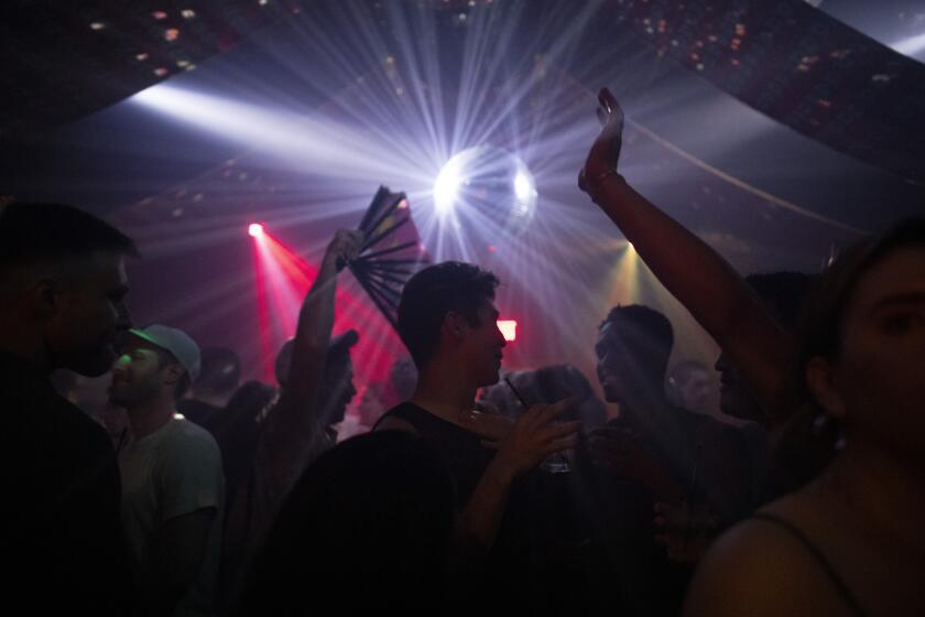 LOS ANGELES, CA - JUNE 19: Akbar was filled to capacity on Saturday, June 19, 2021 following its reopening. The bar is a longtime fixture of LA's gay disco scene and was in danger of closing, but after a successful fundraiser the club is back in action. (Myung J. Chun / Los Angeles Times)